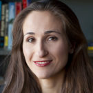 Mindy Romero, headshot style photo, she is looking into the camera and smiling.