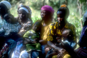 Women and children attend a health information session in Kibwezi, Kenya. (Photo/Laura Ferguson)