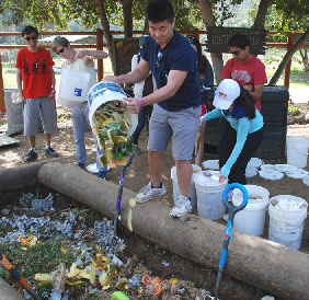 students turn food into compost