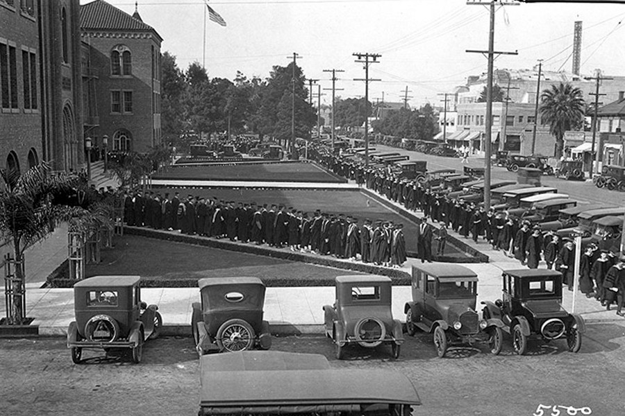 USC commencement photos: 1925: The procession of students begin in front of Bovard along University Avenue (now Trousdale Parkway). (Photo/USC Digital Collections)
