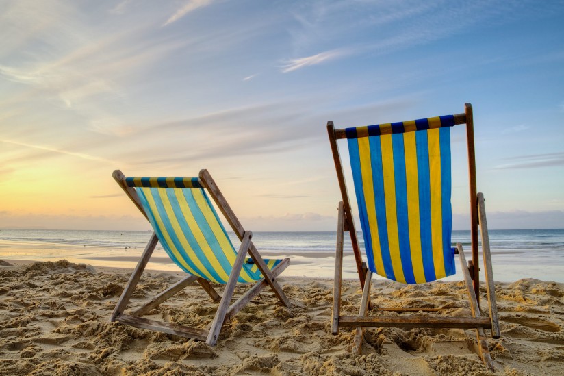 Beach chairs during sunrise