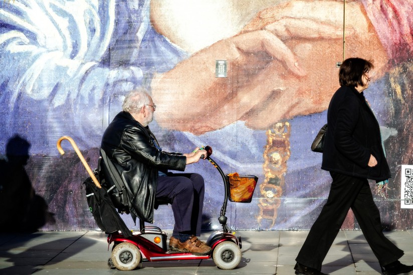 Man riding electric convenience vehicle