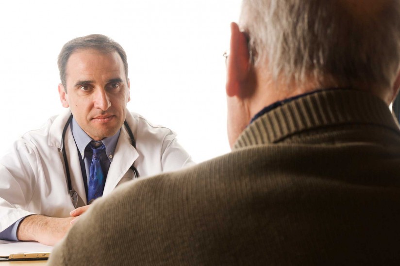 doctor talking to older patient