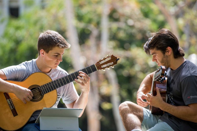Thornton students playing guitar outside