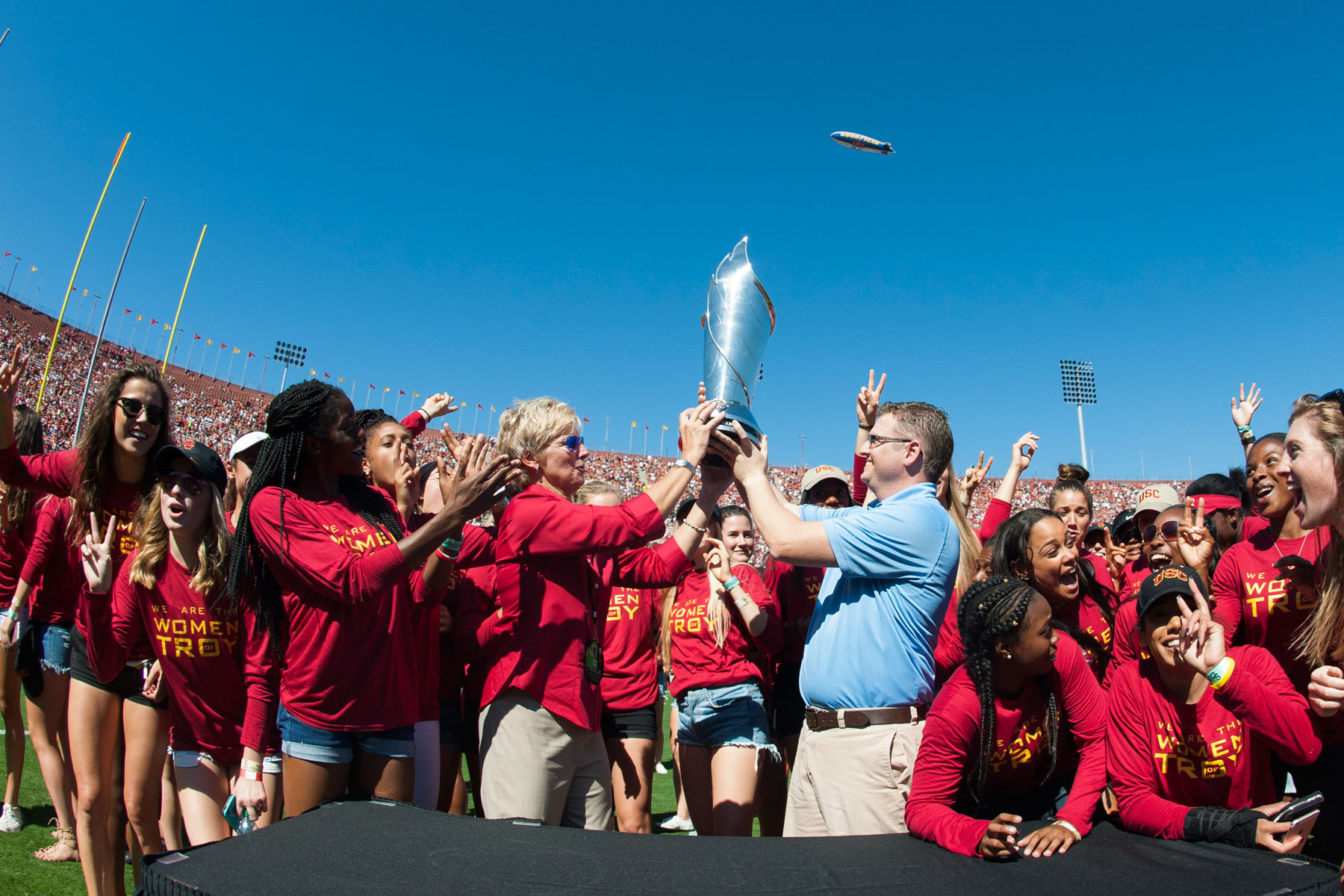 Women of Troy receiving trophy