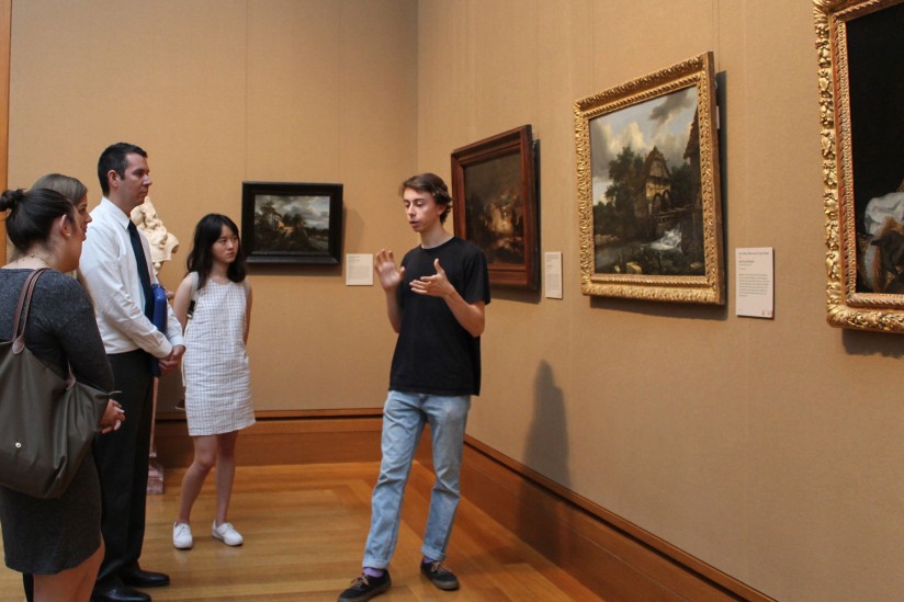 student talking about painting