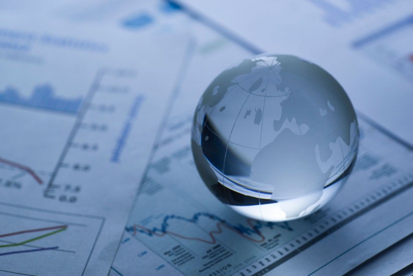 glass globe on business report