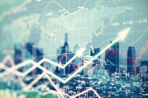 double exposure of city and economics chart