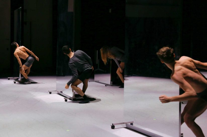 Dancers onstage with mirrors as props