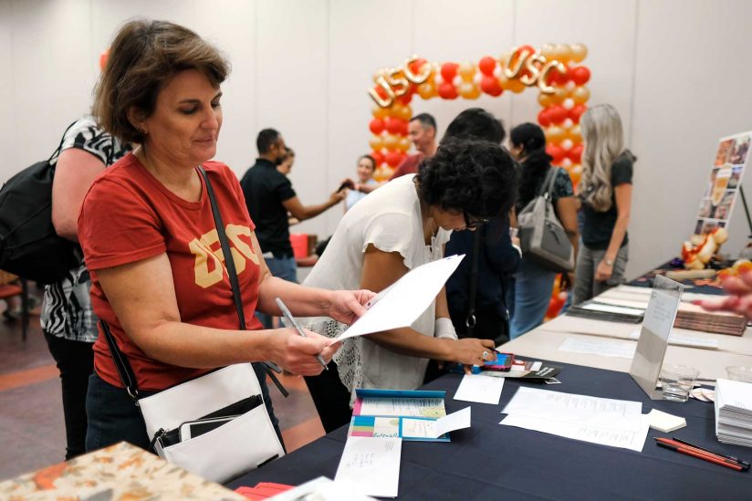 Parents collecting paper for letters