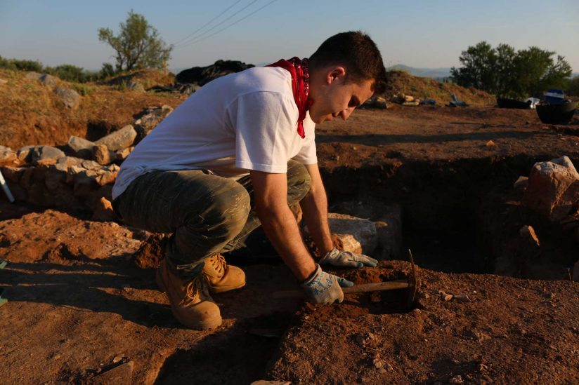 Max Novak at dig site in Greece