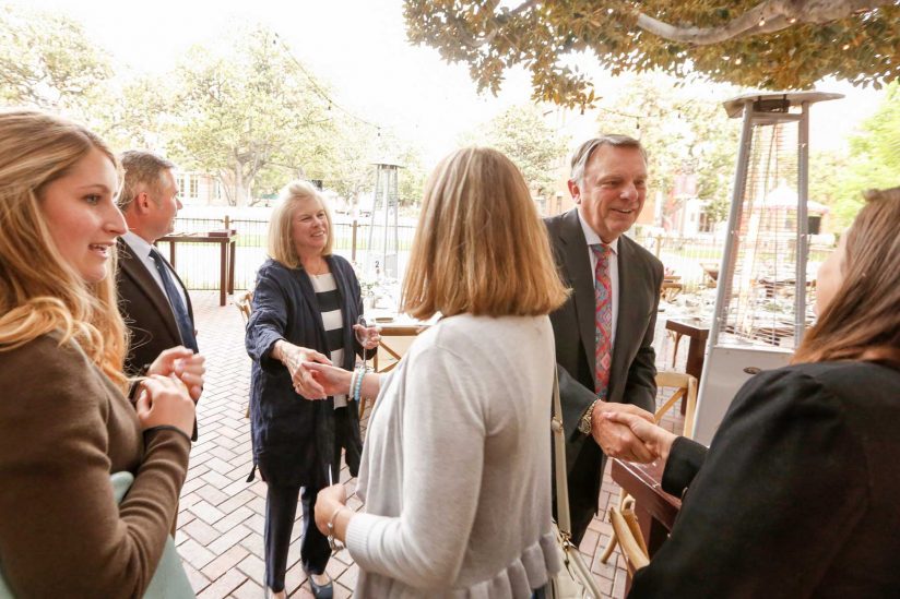 Julie and John Mork greeting students at annual dinner