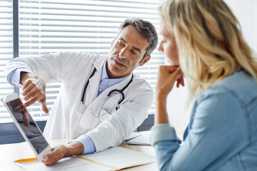 Doctor consulting with patient