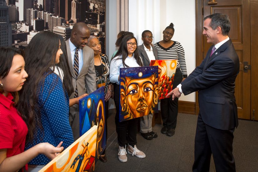 Eric Garcetti with students and Black History Month banners