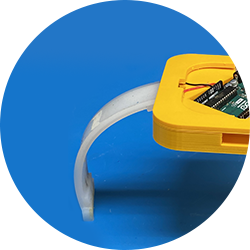 A small robot modeled after a starfish with a yellow body and flexible white arms
