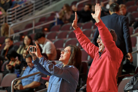 USC spring new student convocation: Family and friends wave to the new Trojans